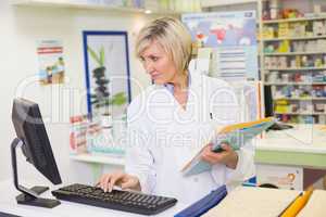 Pharmacist using the computer