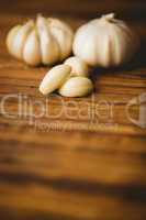 Garlic cloves and bulb on chopping board