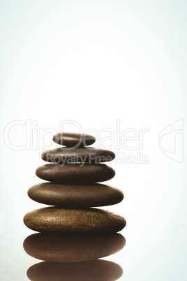 Zen stones balancing on white background