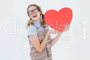 Geeky hipster woman holding heart card