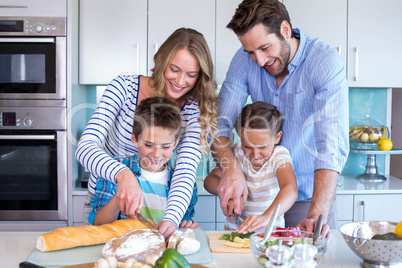 Happy family preparing vegetables together