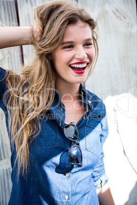 Happy woman touching her hair