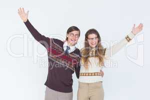 Happy geeky hipster couple embracing