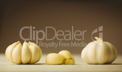 Garlic cloves and bulb on chopping board