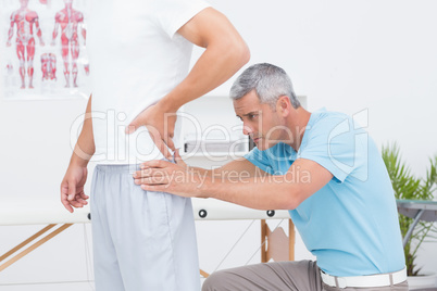 Doctor examining his patient back