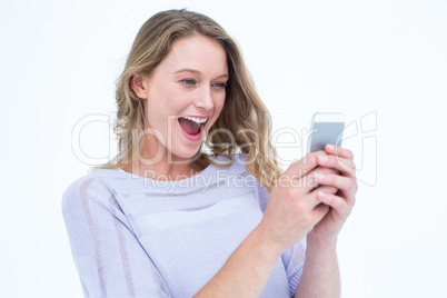 Smiling woman using smartphone