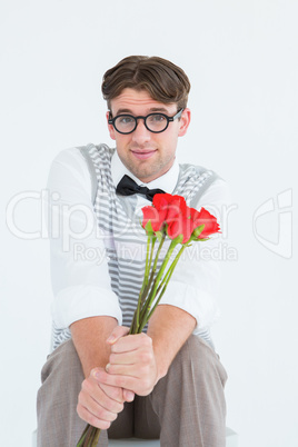 Geeky hipster offering bunch of roses