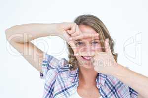 Pretty hipster doing frame with her hands