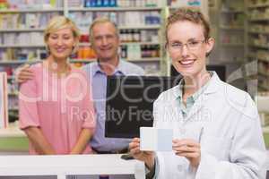 Pharmacist holding medicine box