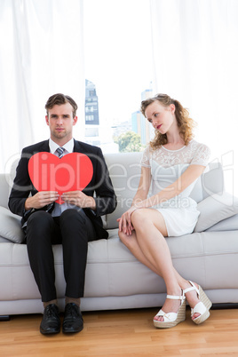 Hipster couple sitting on couch