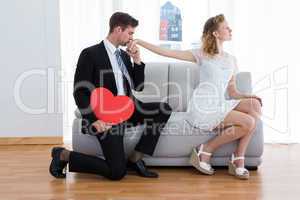 Businessman kissing his girlfriend hand