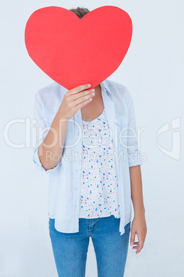 Woman holding heart card