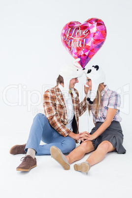 Geeky hipster in love couple looking at each other