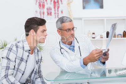 Doctor showing Xrays to his patient