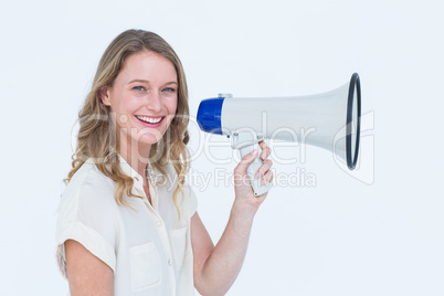 Woman speaking through a loudspeaker