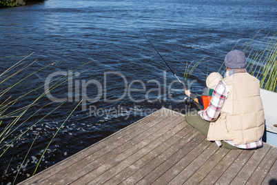 Happy man fishing with his son