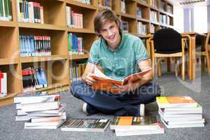 Student sitting on floor in library