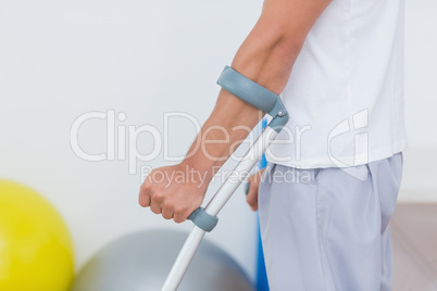 Patient standing with crutch