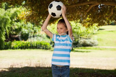 Cute little girl holding ball