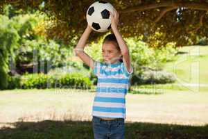 Cute little girl holding ball