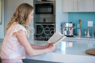 Pretty blonde reading a book