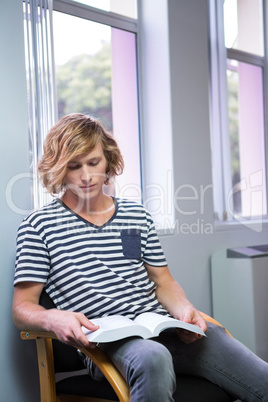 Student reading in library