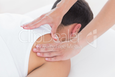 Physiotherapist doing shoulder massage