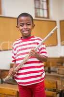 Happy pupil holding flute