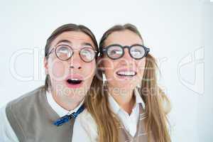 Geeky hipster couple raising eyes