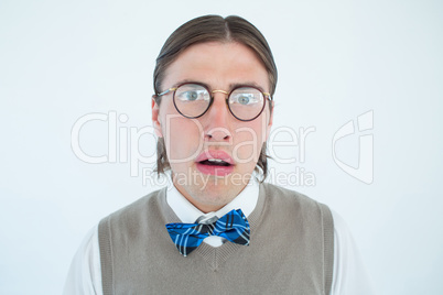 Geeky hipster looking surprised at camera