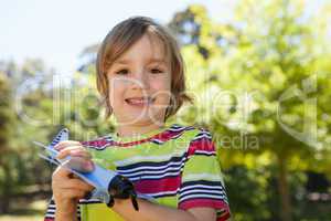 Happy little boy with toy airplane