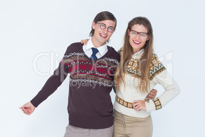 Happy geeky hipster couple embracing