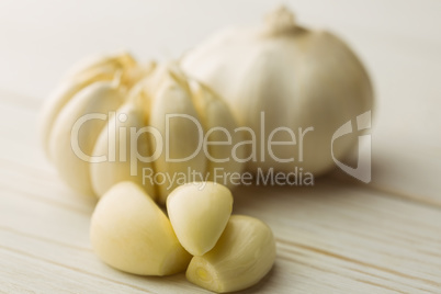 Garlic cloves and bulb on chopping board