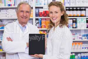 Pharmacist showing tablet pc