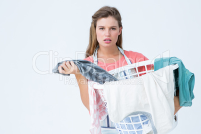 Hipster woman holding laundry basket