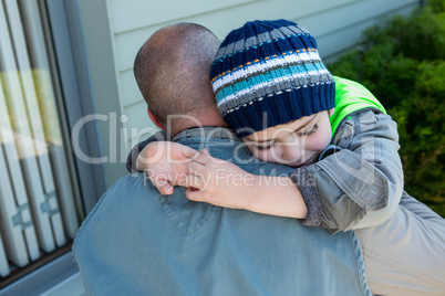 Father and son hugging