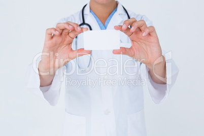 Doctor holding card