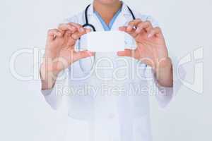 Doctor holding card