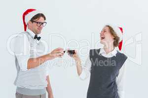 Happy geeky hipster couple drinking red wine