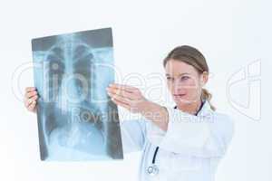 Focused doctor looking at xray