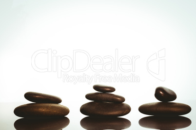 Zen stones balancing on white background