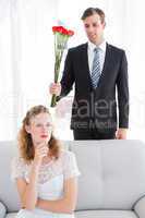 Happy businessman giving roses to his girlfriend