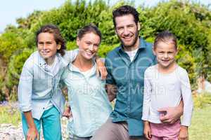 Happy family smiling at camera