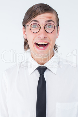 Geeky businessman smiling at camera