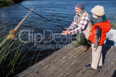 Happy man fishing with his son