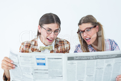 Geeky hipsters reading the newspaper