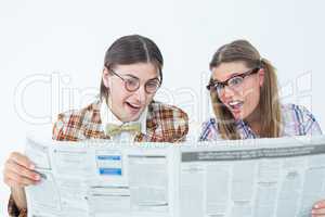 Geeky hipsters reading the newspaper