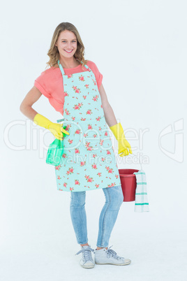 Woman wearing protective gloves and holding bucket