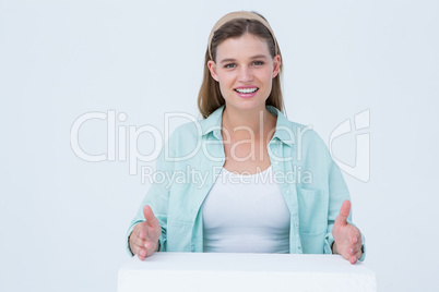 Happy hipster putting her hands on box Happy hipster putting her hands on box