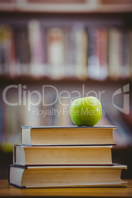 Apple on pile of books